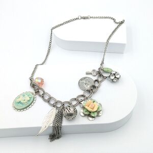4/24$  Victorian-inspired upcycled charm necklace